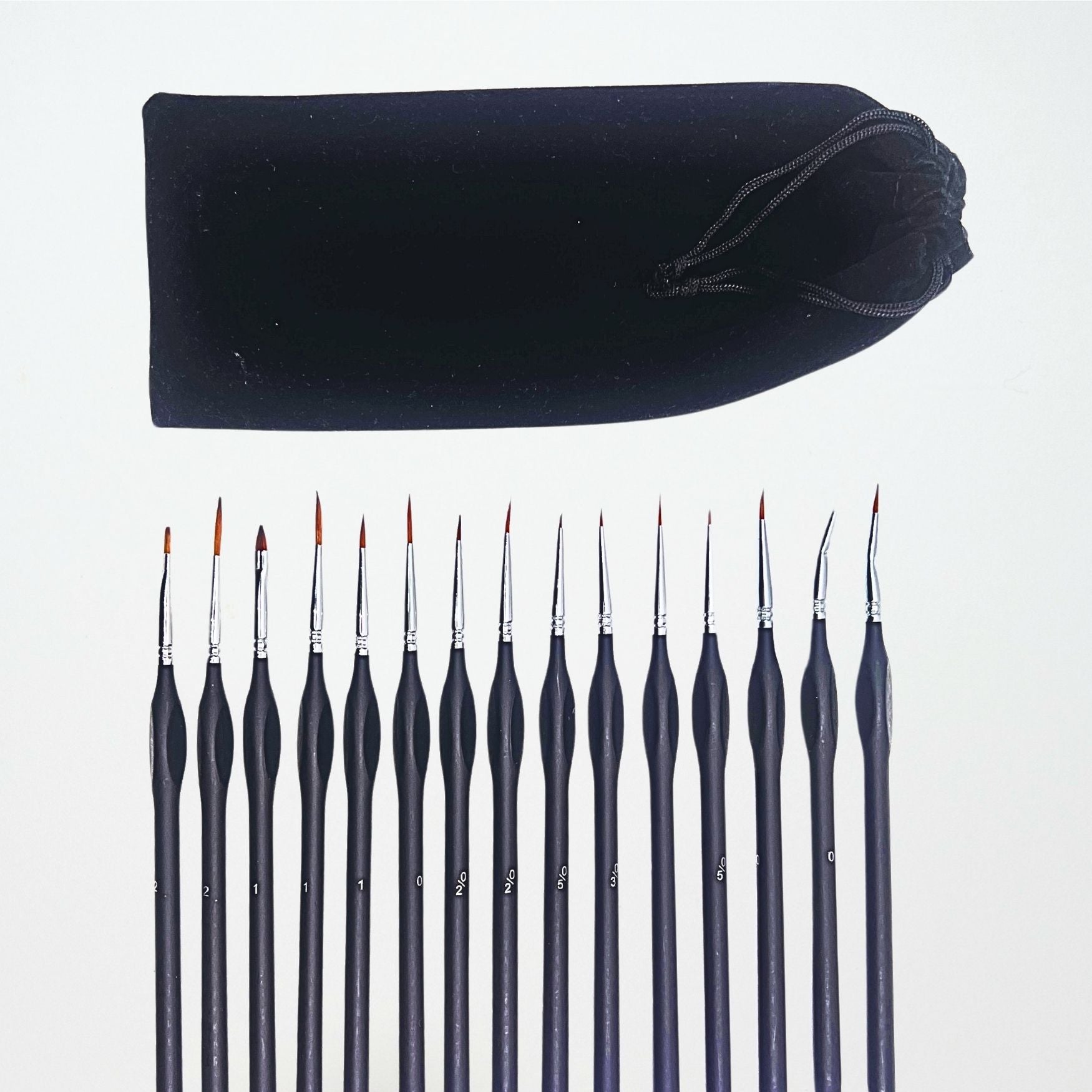 Set of 15 paintbrushes with a black drawstring bag on a white background