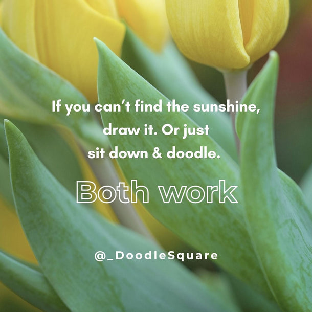 Two yellow tulips with a motivational quote on a blurred green background