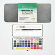 Watercolor set with 50 colors, brush, and accessories on a white background