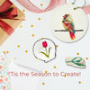 Decorative items with bird and flower designs on a white background with red ribbons.